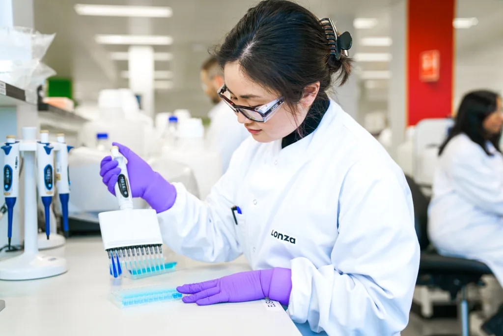 man working with microscope in lab,Process Development,Biologics_Slough_18,,lab in slough,tech working in lab with computer,male tech pipetting,tech holding vial,tech working,Cell Iine process development,biologics lab worker, ,Biologics_Slough_29,Biologics , Biologics Slough 