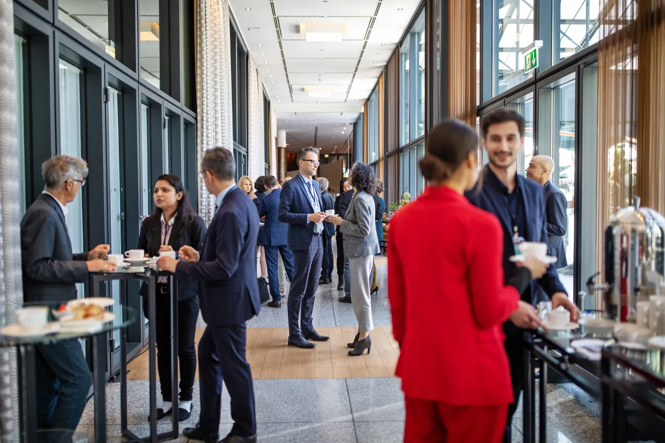 Business people having a refreshment break at a conference.