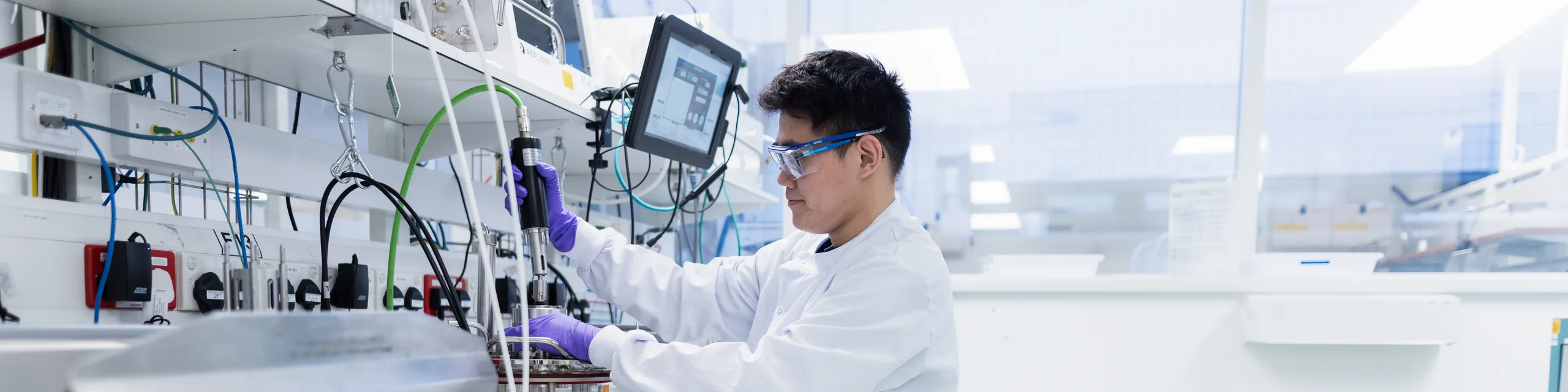 man working with microscope in lab,Process Development,Biologics_Slough_18,,lab in slough,tech working in lab with computer,male tech pipetting,tech holding vial,tech working,Cell Iine process development,biologics lab worker, ,Biologics_Slough_29,Biologics , Biologics Slough 